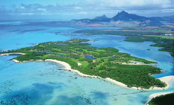 aerial view of the golf fairways on Ille au Cerfs surrounded by turquoise sea.