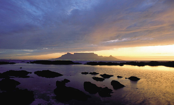 Sun setting over Table Mountain with views across Table Bay.