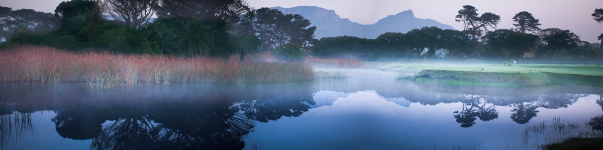 Early morning mist hangs over the lake at the Royal Cape Golf Club.