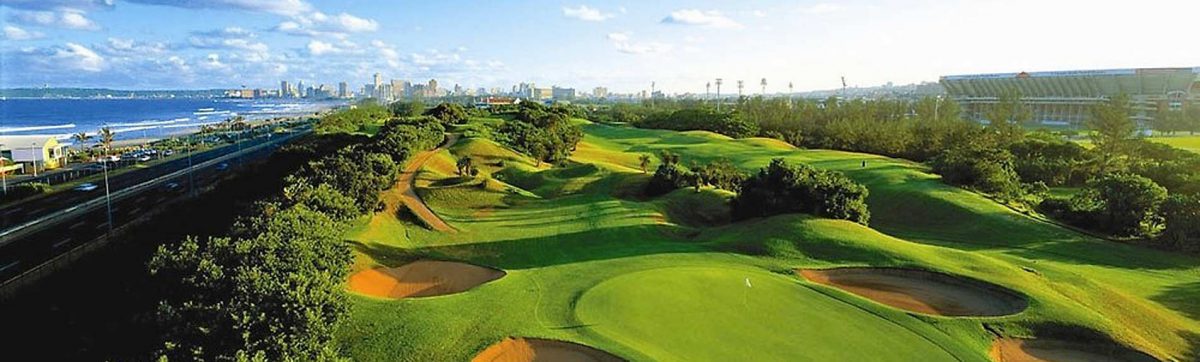 Durban Country Club golf course with skyline of central Durban skycap behind.