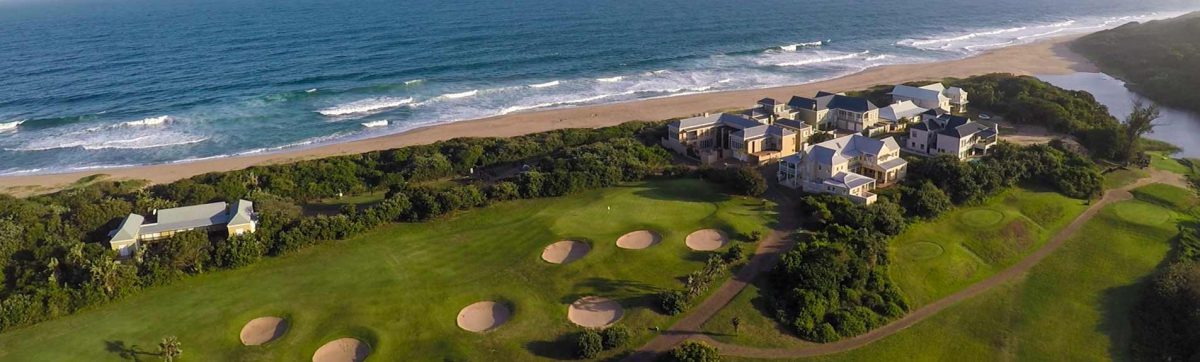 aerial view of the fairways and bunkers that are flanked by the Indian ocean.