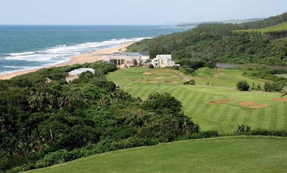 views from the elevated tee bow looking down onto the fairways with the indian ocean in the distance.