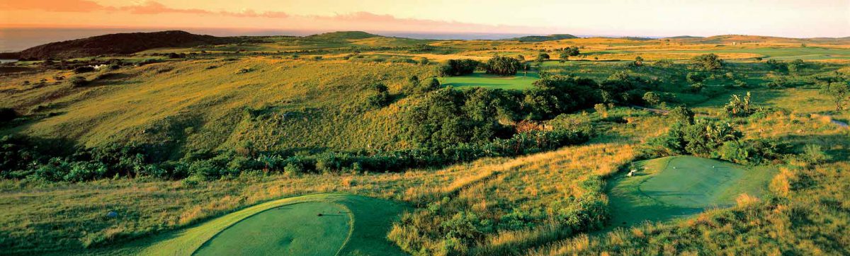 Tee boxes are mown into the grassy banks of the course with panoramic views in every direction.