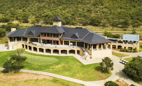 The three story clubhouse at Euphoria overlooks the practice putting green.