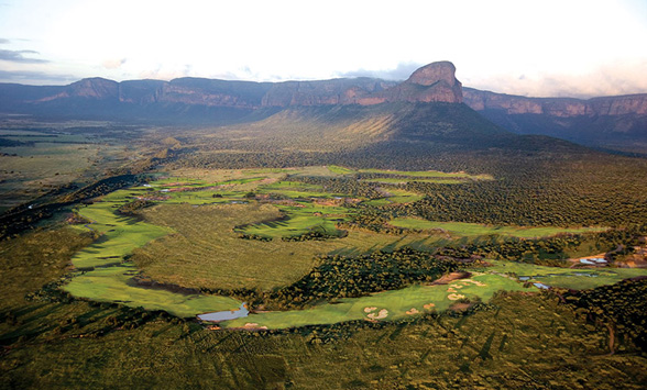 aerial views of the golf course at Entabeni which is surrounded by a game reserve with the touring Hang-up mountain in the distance.