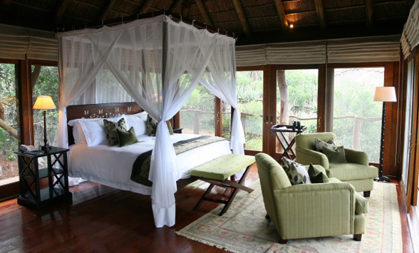 Romantic Four poster bed in the suite at Pumba Game Reserve.