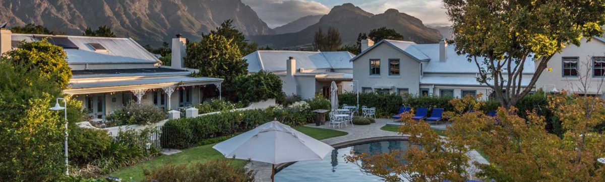 Sun setting in the Franschhoek Mountain Valley over Le Quartier Francais.