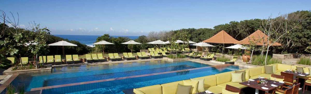 Swimming pool overlooking the Indian ocean and beach at the Fairmont Zimbali Resort.