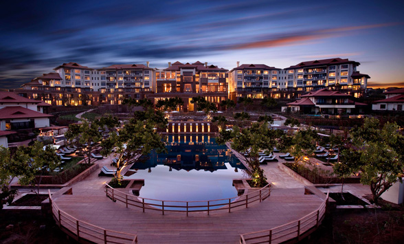 Sunset over the Fairmont Zimbali Hotel reflected in the pool.