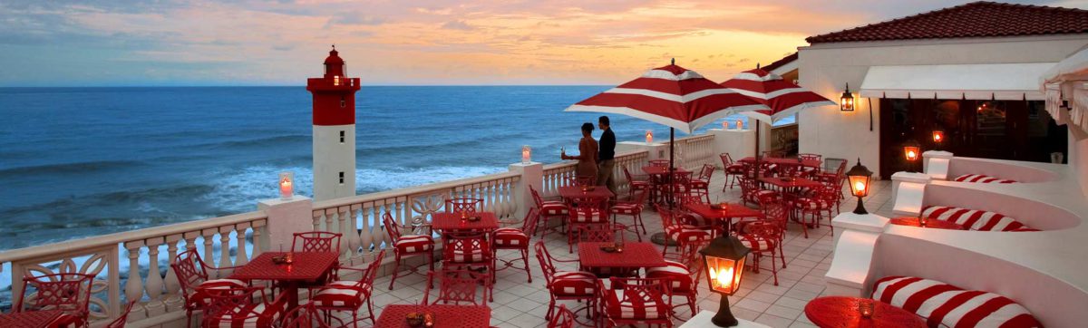 Romantic scene at sunset by the swimming pool of the Oyster Box Hotel.