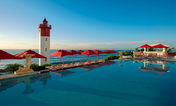 Views across the Oyster Box Hotel pool to the Indian Ocean.