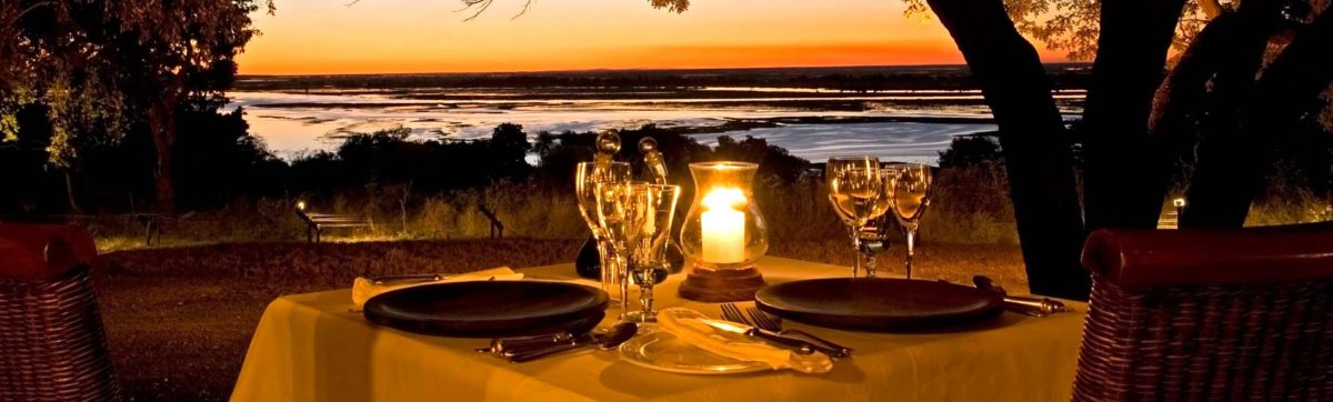 Romantic dining and sunset over the Chobe River.