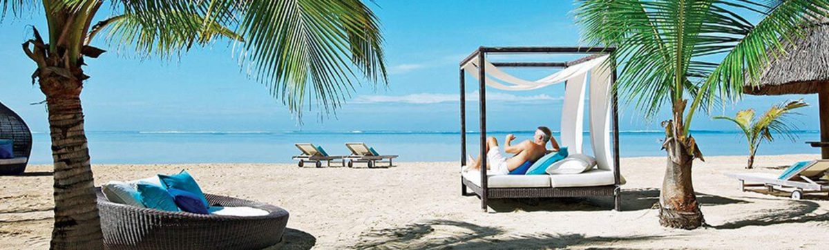 Soaking up the sun on a lounger on the Bel Ombre beach at the Heritage Awali Hotel.