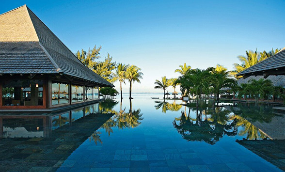 Palms reflected in the swimming pool at the Heritage Awali