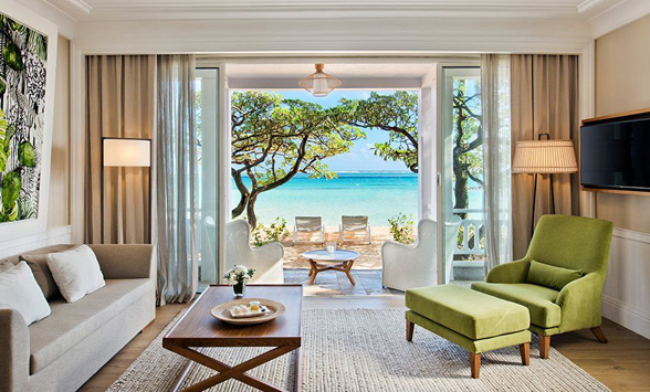 Turquoise blue lagoon through the window of a beach villa at Heritage Le Telfair