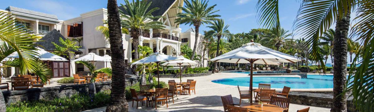 View across the swimming pool to the main reception at The Residence, Mauritius.