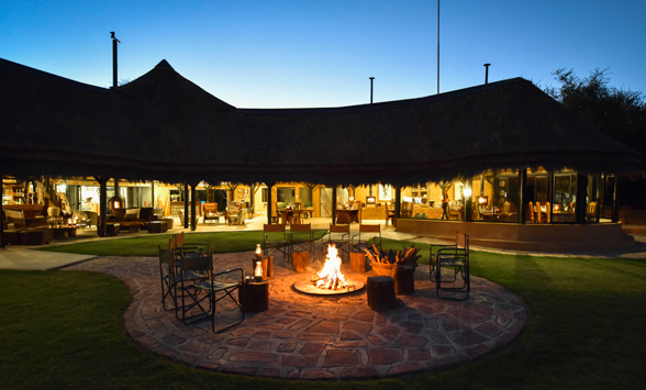 A roaring fire in the boma as dusk settles over the Okonjima Bush Camp.