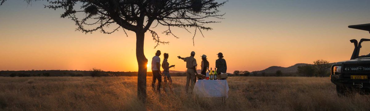 Sun downer drinks stop as the sun sets over the Etosha National Park area.