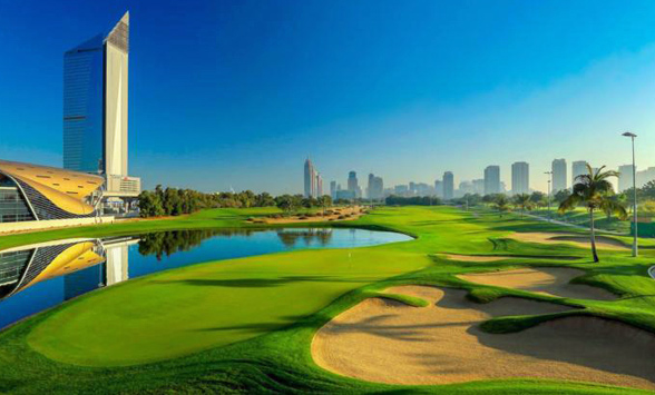 blue skies over the green fairways and lakes of the Faldo Course, Dubai.