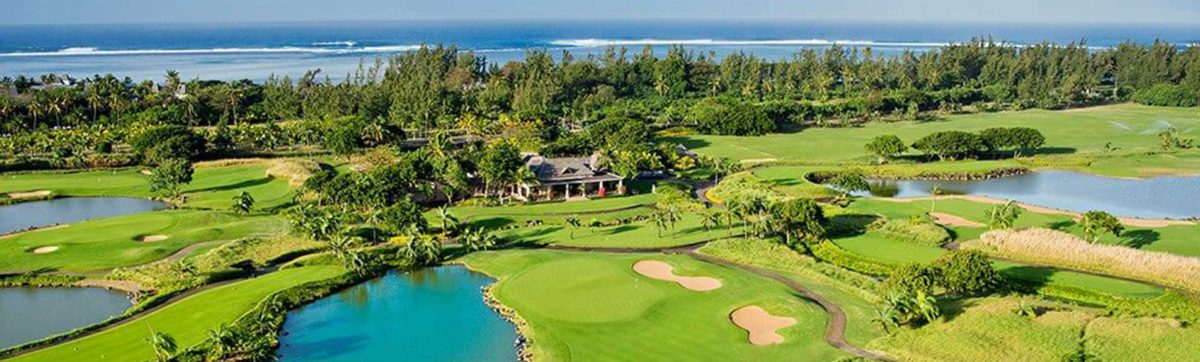 aerial view of the golf course in Mauritius with the blue ocean beyond.