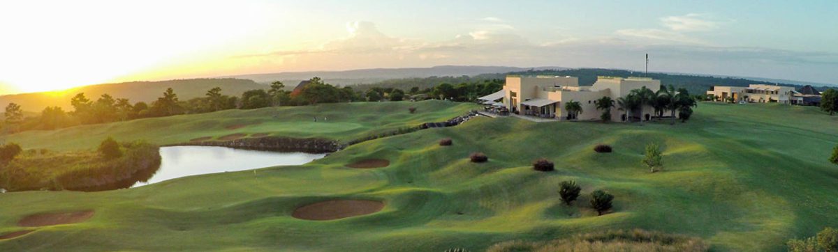 Sun rising over the Indian Ocean and long shadows on the golf course at Vipingo Ridge.