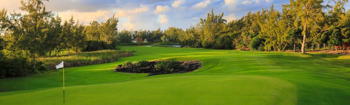 flag pin, green and fairways at Anahita Golf Club