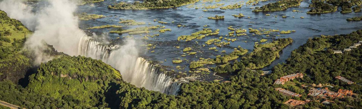 Aerial view of the spray at Victoria Falls and the Zambezi River.