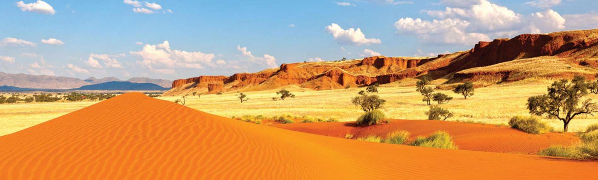 Red sand dunes and rock formations