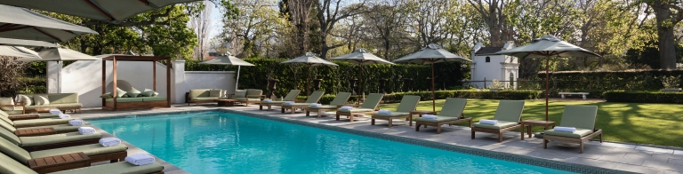 sun loungers around the pool at the Alphen Hotel